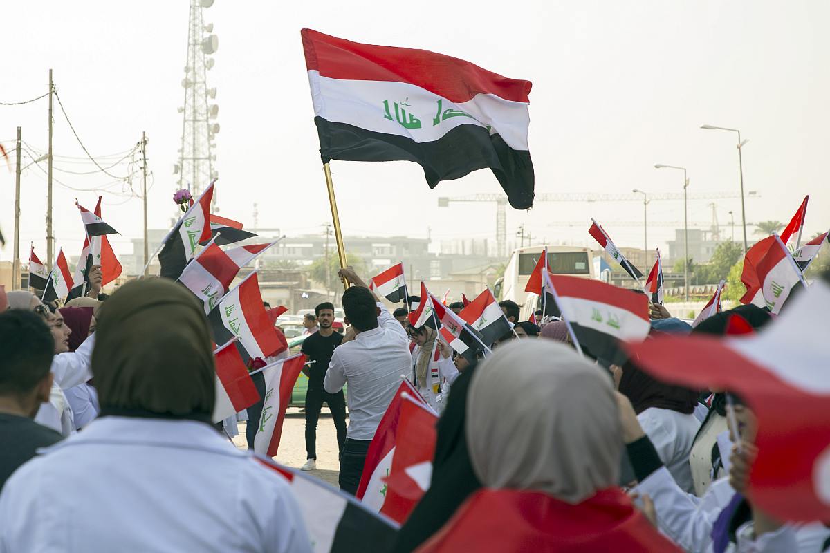 US urges early Iraq elections, halt to violence against protesters