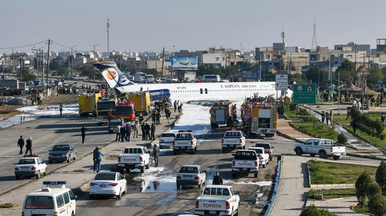 Iran airliner overshoots runway, stops in highway