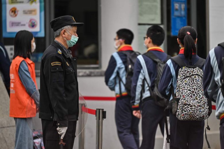 Students return to class in Shanghai and Beijing