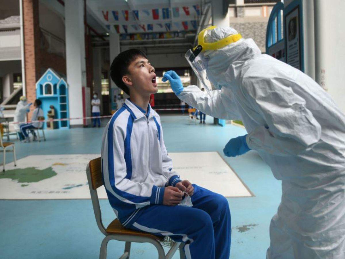 In schools and offices, China steps up virus tests