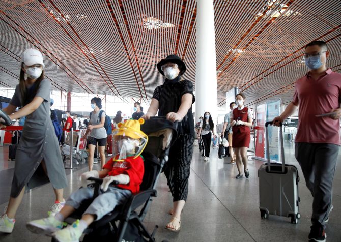 Beijing cancels hundreds of flights, trains as COVID-19 cases spike