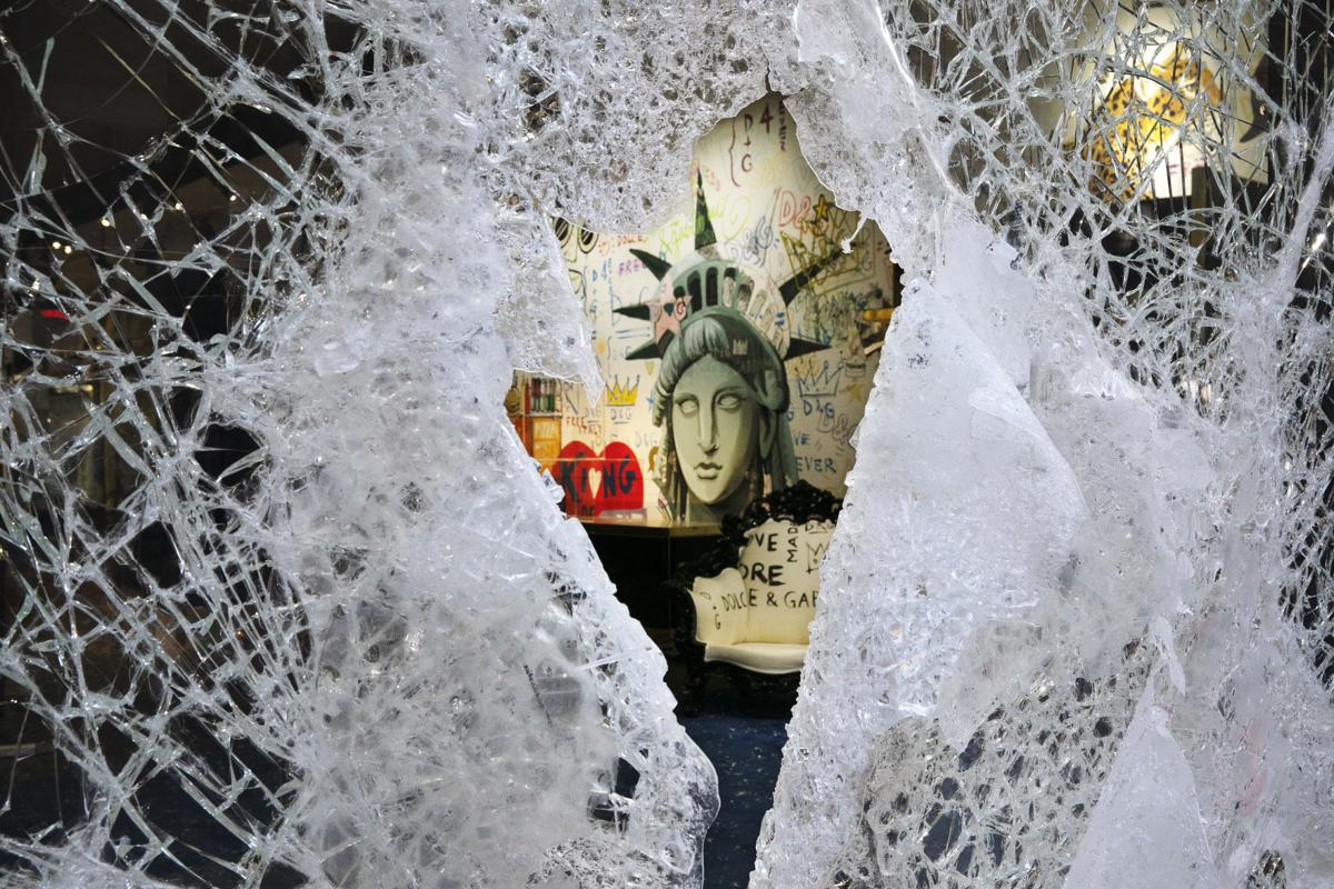 New York under curfew as looters hit luxury stores