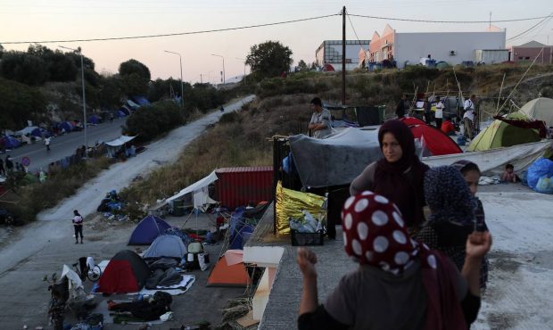 Greek police begin moving asylum-seekers into new camp