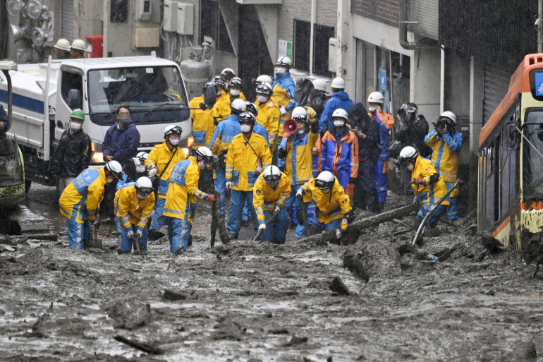 Rescuers search for survivors in landslide-hit Japan town