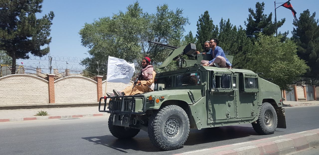 Victorious Taliban fighters patrolled