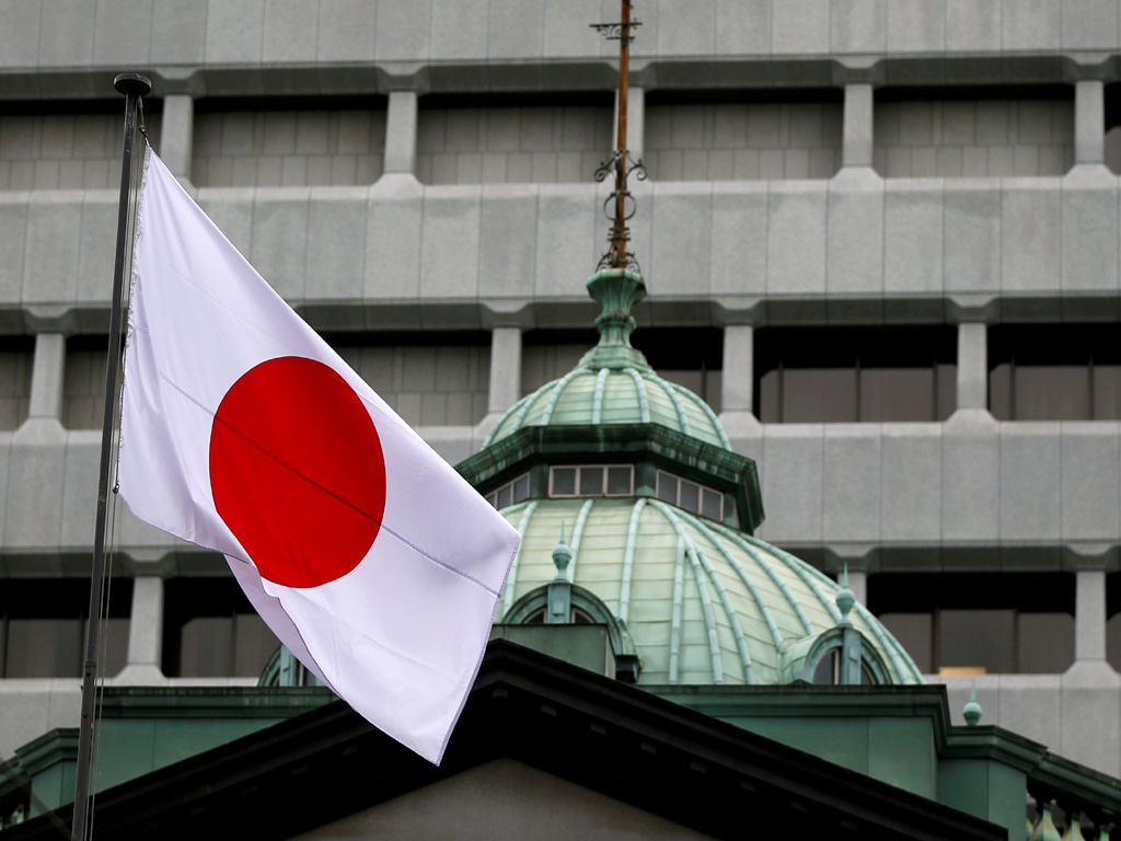 Bank of Japan lowers annual growth estimate on Covid pressures