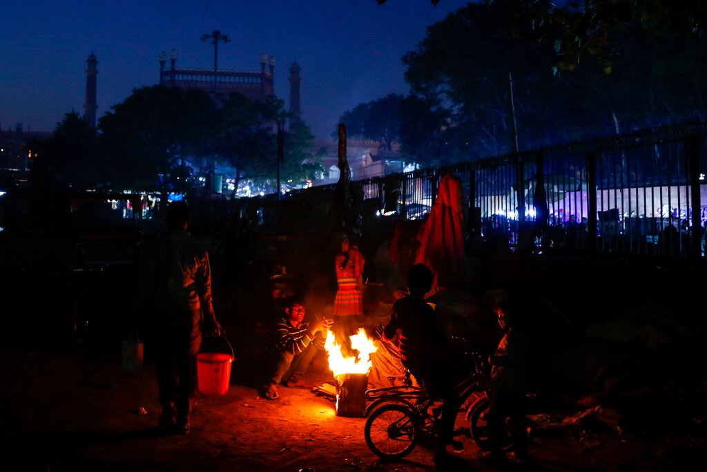New Delhi’s homeless shiver through harsh cold snap