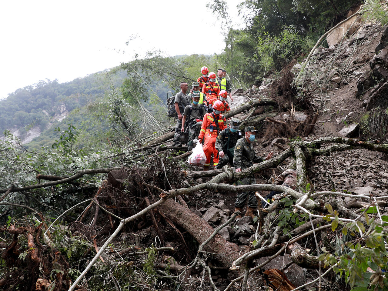 Downpours and mudslides hamper China earthquake rescue mission