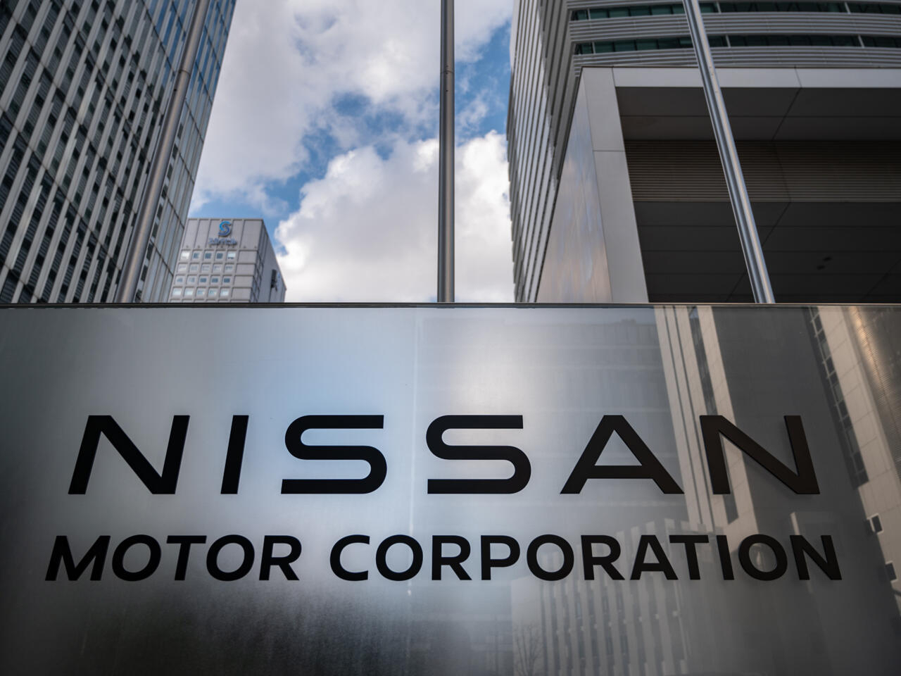 Nissan keeps annual profit forecasts, cuts unit sales target